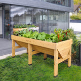 Voll bepflanztes 1,8 m VegTrug Hochbeet mit einer großen Auswahl an Gemüse und Kräutern auf der Terrasse